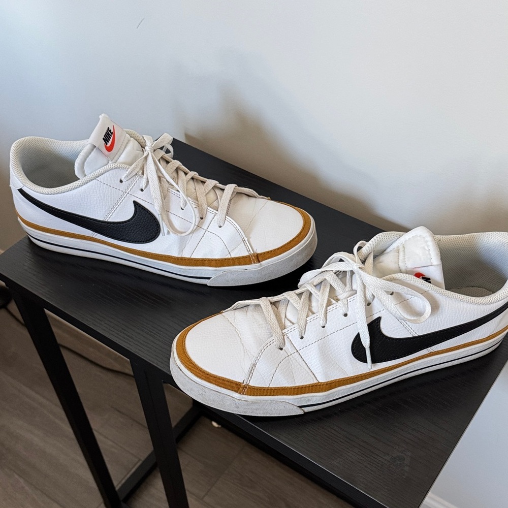 Nike Men's White and Black Sneakers with Gold Accents